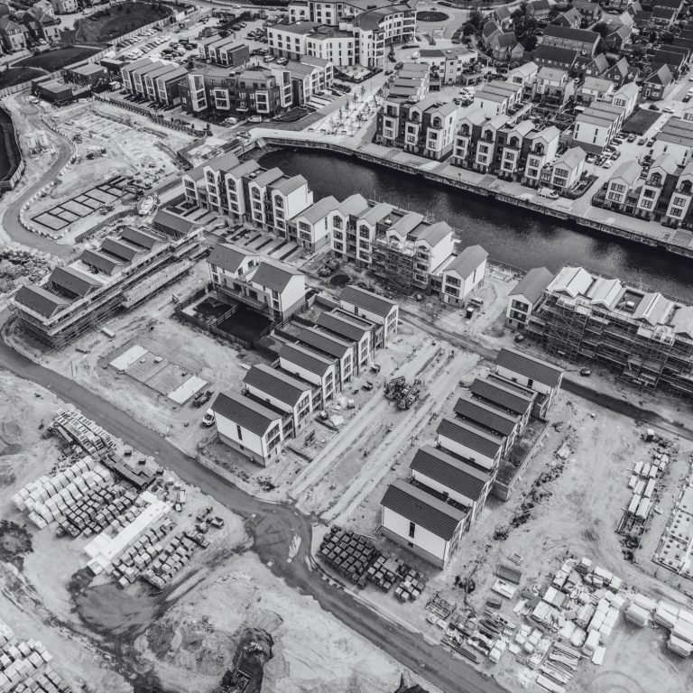 Construction Sites Aerial view of a construction site with modern buildings and waterways at St Mary's Island, Chatham, Kent, England.